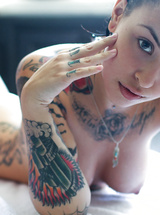 Sexy babes exposing their colorful tattooed bodies