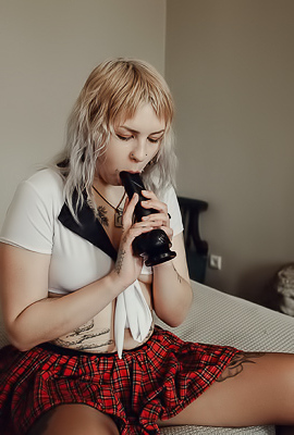 Sem Retlick Grabs Her Ass Enticingly In A Plaid Skirt And Black Pantyhose