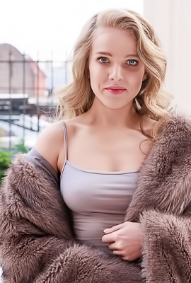 Xenia Teases Solo With Panties And Flowers On A Couch Indoors