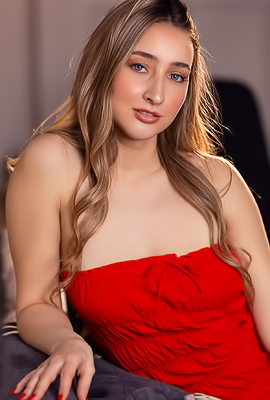 Lula Stocch Poses Seductively In A Red Minidress Showing Tan Lines On The Couch